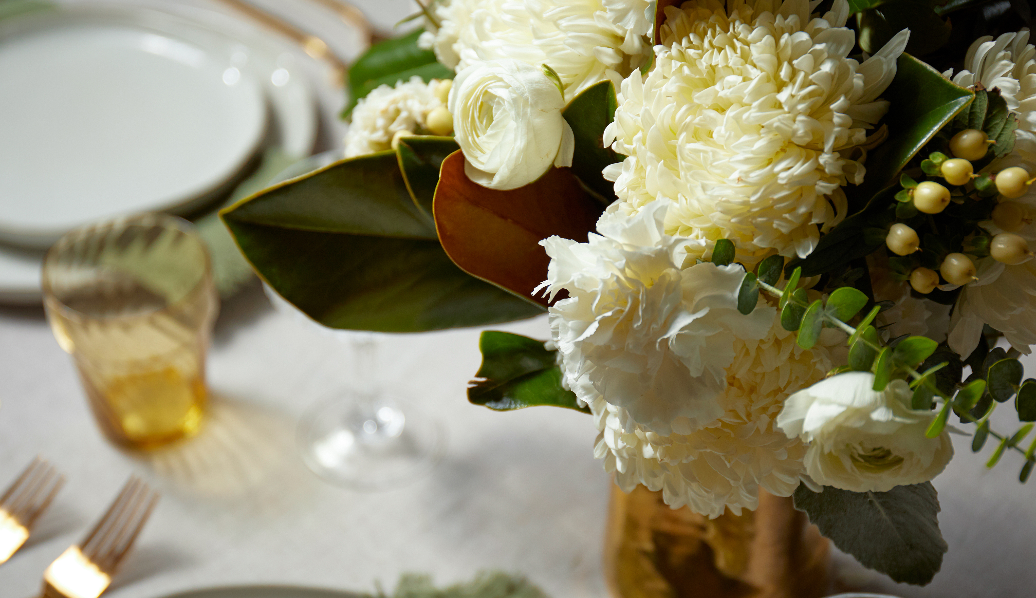 Close up of bouquet with magnolia leaves. 